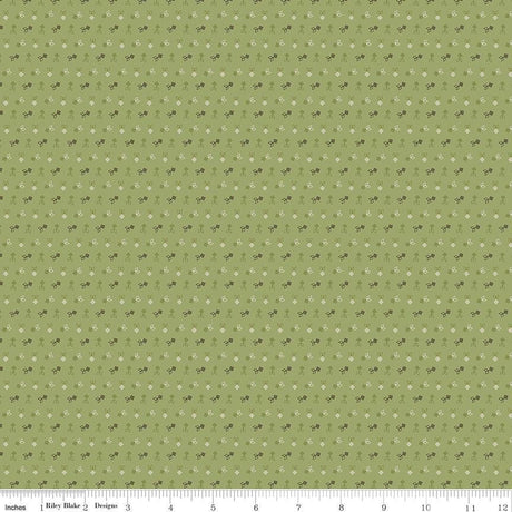 The image is a repeating pattern of small white flowers or dots on a green background.