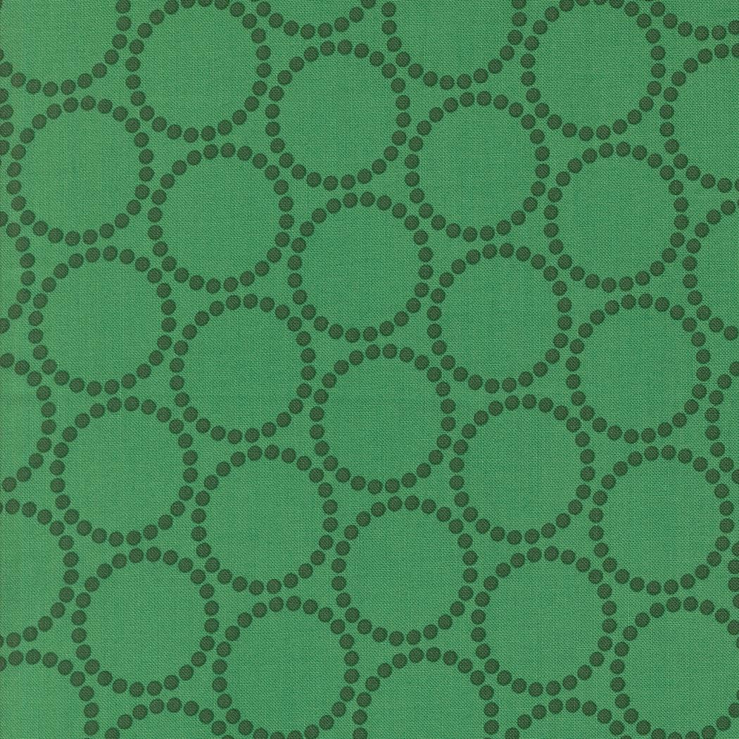a repeating pattern of green circles on a green background.