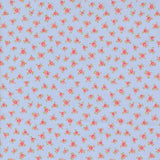 a pattern of small pink flowers on a light blue background.