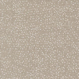 The image is a close-up of a textured fabric with small white dots or dots scattered across it, creating a speckled or speckled appearance.