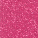 The image is a close-up of a pink fabric with small white dots or specks scattered across it, creating a textured and speckled appearance.