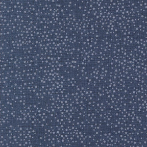 The image is a close-up of a dark blue fabric with numerous small white dots scattered across it, creating a speckled or speckled pattern.