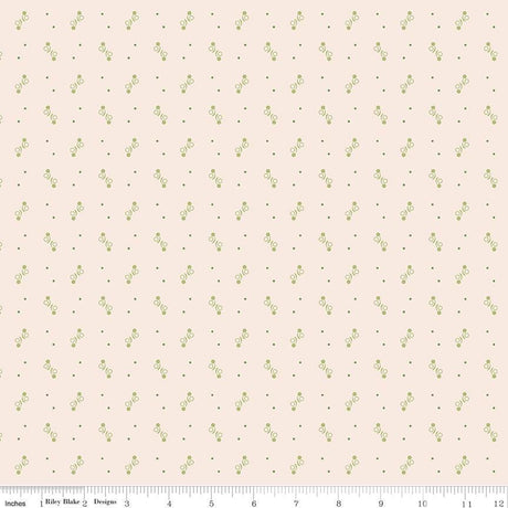 a repeating pattern of small green dots on a light pink background.