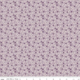 The image is a repeating pattern of purple flowers and leaves, with small white dots scattered throughout the design.