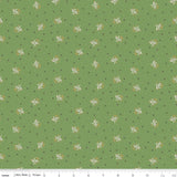 a repeating pattern of small white flowers against a green background.