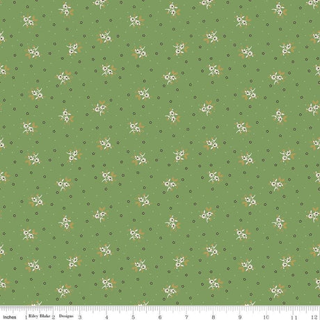 a repeating pattern of small white flowers against a green background.