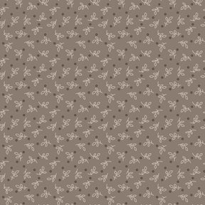 a repeating pattern of small white dots and lines on a brown background.