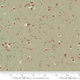 The image is a fabric with a speckled pattern in shades of brown and beige.