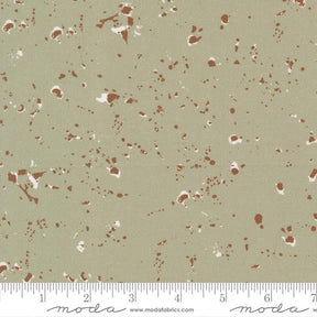 The image is a fabric with a speckled pattern in shades of brown and beige.