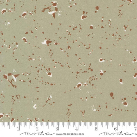 The image is a fabric with a speckled pattern in shades of brown and beige.