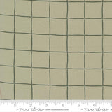 The image is a close-up of a fabric with a grid pattern of squares, measuring approximately 1.5 inches by 1.5 inches.