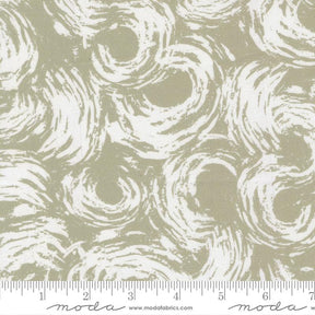 The image is a fabric with a repeating pattern of white swirls or curves. The pattern is not uniform, with some areas appearing more prominent than others. The fabric is described as having a beige or brownish hue, and it is shown in a close-up view. The image is not a single, continuous scene but rather a collection of individual images that have been combined to create the overall pattern.