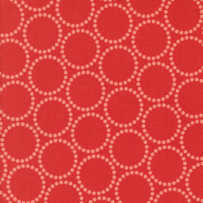 a repeating pattern of red circles with white dots on a red background.