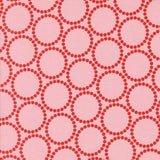 a repeating pattern of pink circles on a pink background.