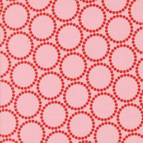 a repeating pattern of pink circles on a pink background.
