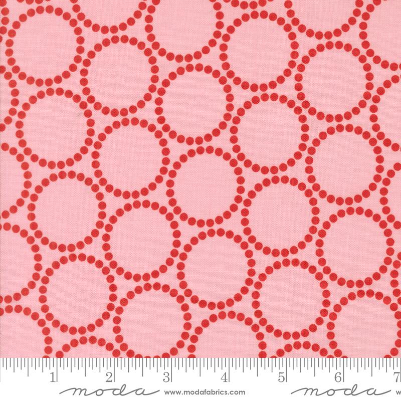 a repeating pattern of pink circles on a white background.