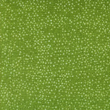 The image is a close-up of a green fabric with small white dots or specks scattered across it, creating a textured and speckled appearance.