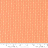 The image is a fabric with a repeating pattern of orange and white lines, creating a textured and visually interesting design.