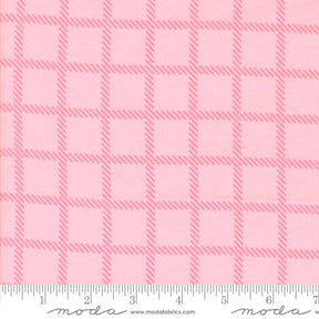 a pink fabric with a repeating pattern of pink squares and thin pink lines, creating a checkered or plaid design.