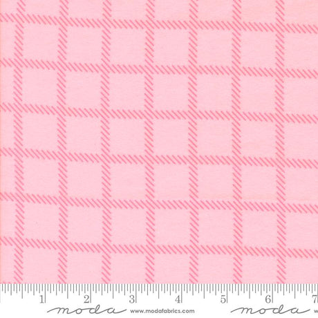 a pink fabric with a repeating pattern of pink squares and thin pink lines, creating a checkered or plaid design.
