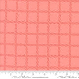 The image is a close-up of a fabric with a repeating pattern of red squares arranged in a grid-like fashion.