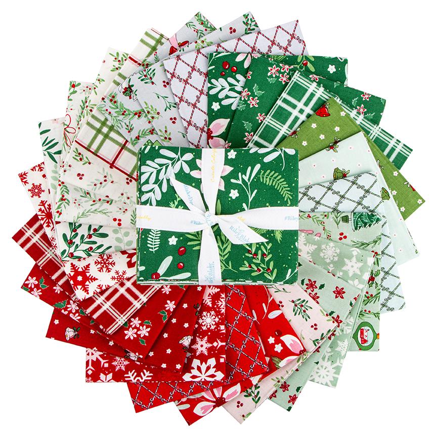 A circular arrangement of various fabric pieces with different patterns and colors, including red, green, white, and other festive designs, all tied together with a white ribbon bow.