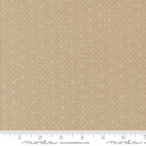 The image is a fabric with a beige pattern, featuring small white dots or stars arranged in a repeating design. The fabric appears to be a light-colored material, possibly a type of cotton or linen. The image does not contain any text or other discernible objects or actions.
