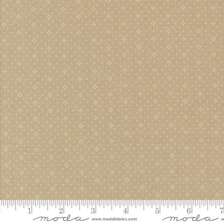 The image is a fabric with a beige pattern, featuring small white dots or stars arranged in a repeating design. The fabric appears to be a light-colored material, possibly a type of cotton or linen. The image does not contain any text or other discernible objects or actions.