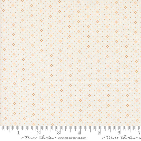 a fabric with a repeating pattern of small orange dots or stars on a light beige background. The fabric appears to be a fabric with a repeating pattern, possibly a fabric with a geometric or polka dot design. The image does not contain any text or other objects, and the focus is on the pattern and color of the fabric.