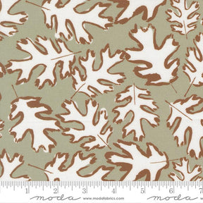a repeating pattern of white and brown leaves on a green background.