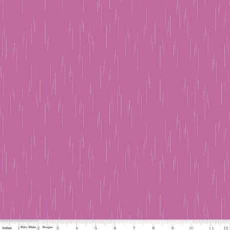 The image is a pink background with white dots or lines scattered across it, creating a visually interesting and abstract pattern.