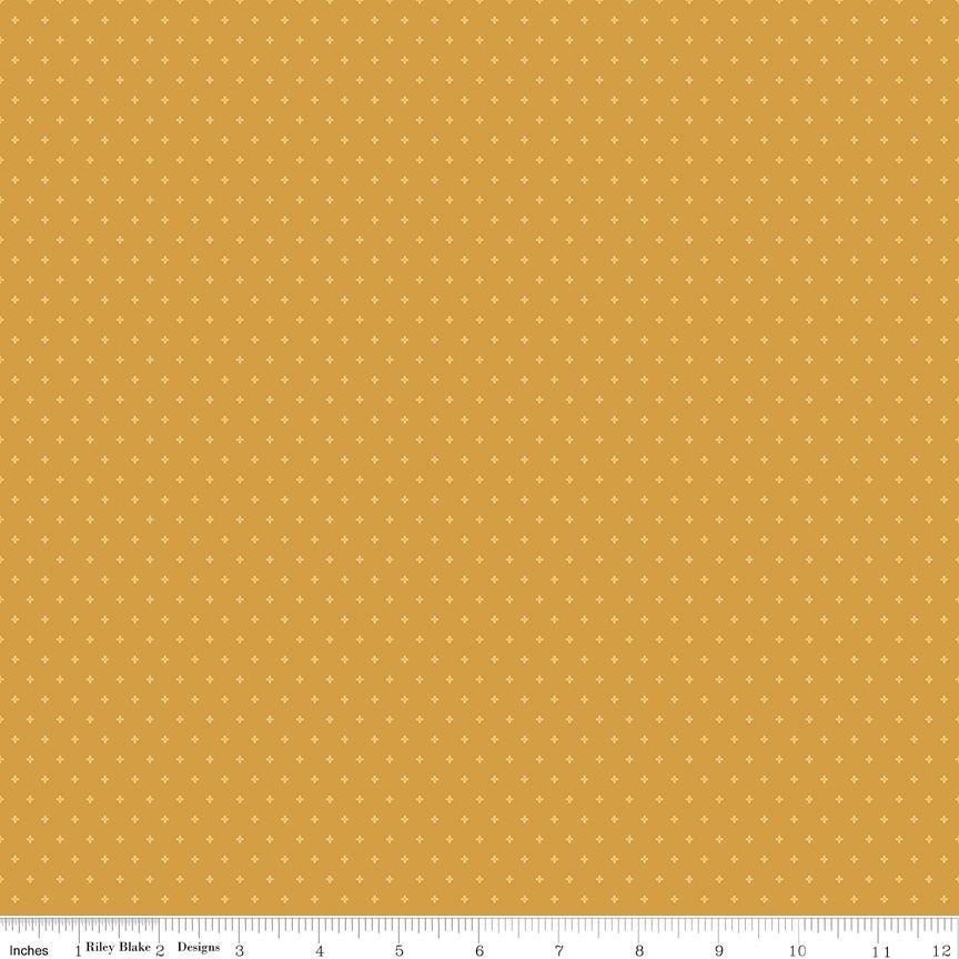 The image is a repeating pattern of small yellow dots on a light brown background.