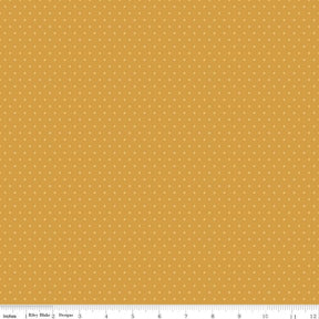 The image is a repeating pattern of small yellow dots on a light brown background.