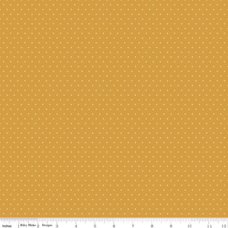 The image is a repeating pattern of small yellow dots on a light brown background.