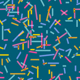 a vibrant and colorful pattern of overlapping and intersecting lines and shapes in various bright colors such as pink, yellow, blue, and green. The pattern appears to be a repeating design, creating a visually striking and dynamic composition.