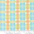 The image is a fabric with a plaid pattern in shades of blue, green, and orange. The fabric appears to be a soft, textured material suitable for clothing or home decor.