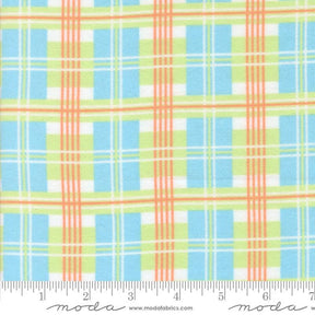 The image is a fabric with a plaid pattern in shades of blue, green, and orange. The fabric appears to be a soft, textured material suitable for clothing or home decor.