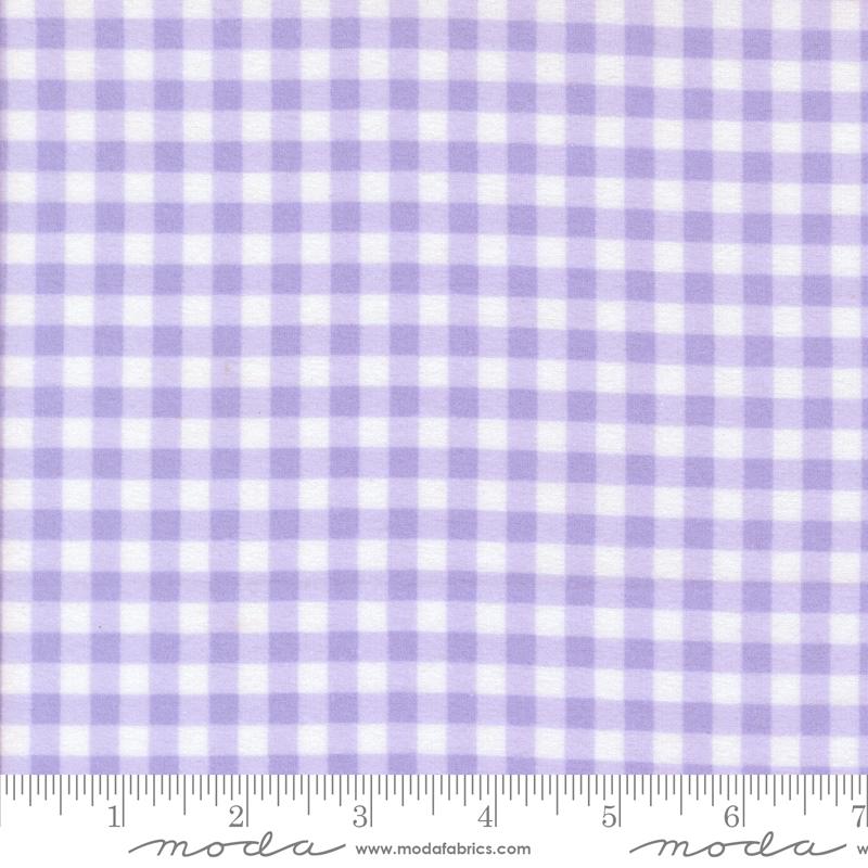 a fabric with a purple and white gingham pattern, which is a type of checkered fabric. The fabric appears to be a fabric with a purple and white checkered pattern, and it is described as a fabric with a purple and white checkered pattern.