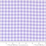 a fabric with a purple and white gingham pattern, which is a type of checkered fabric. The fabric appears to be a fabric with a purple and white checkered pattern, and it is described as a fabric with a purple and white checkered pattern.