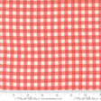 The image is a close-up of a fabric with a red and white checkered pattern.