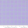a fabric with a purple and green checkered pattern. The fabric appears to be a fabric with a grid-like design, with squares and rectangles in shades of purple and green. The fabric is displayed on a ruler for scale, indicating its size.