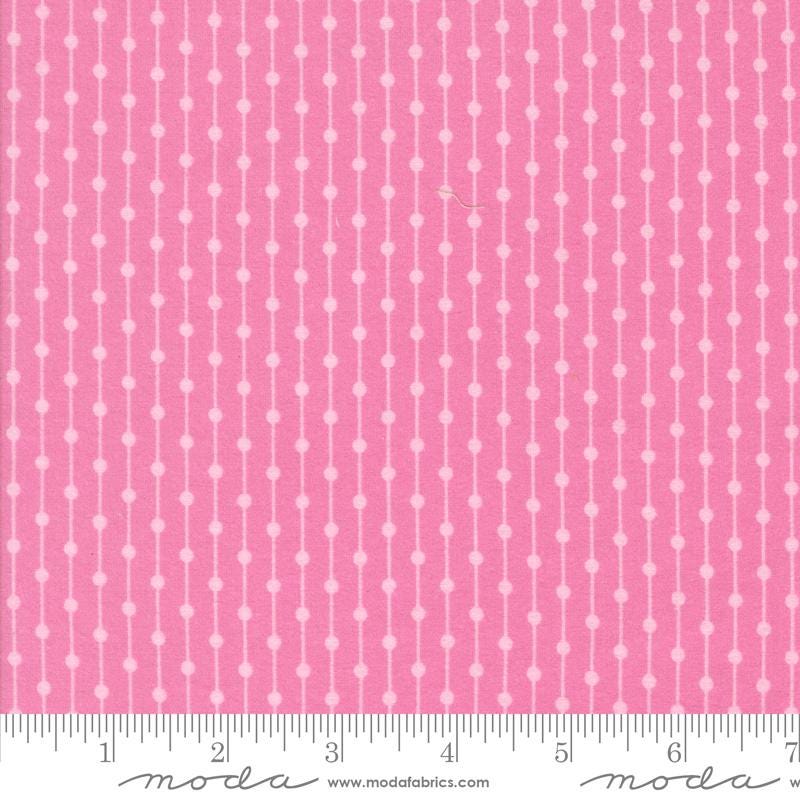 The image is a close-up of a fabric with a pink and white striped pattern.