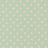 a repeating pattern of small white and red hats on a light green background.