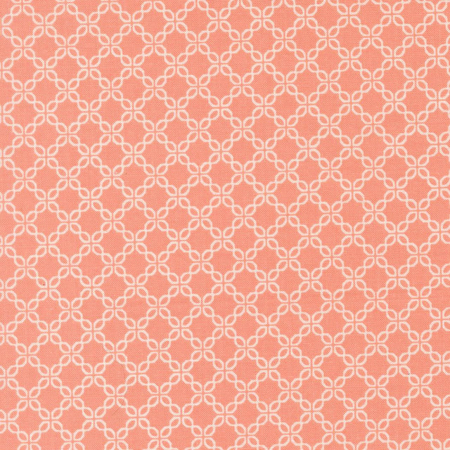 a repeating pattern of white and peach-colored diamond shapes arranged in a grid-like fashion.