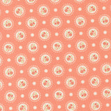 a repeating pattern of white circles with floral designs on a coral-colored background.