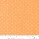 The image is a fabric with a repeating pattern of small white dots or stars on an orange background.