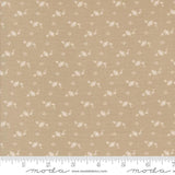 The image is a fabric with a repeating pattern of small white flowers or leaves. The pattern is evenly spaced and covers the entire fabric surface.
