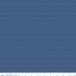 The image is a blue fabric with a repeating pattern of hexagons.