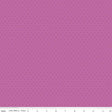 The image is a close-up of a fabric with a pink background and small white dots, resembling a polka dot pattern.