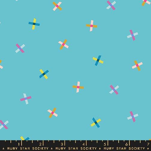 a pattern of colorful crosses on a blue background.